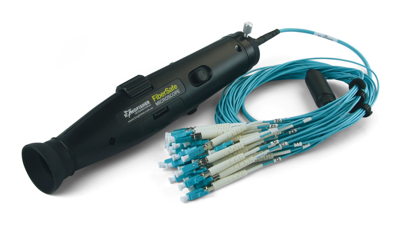 Graphic of a hand-held fiber inspection scope which can identify defect or contamination of fiber optic cables.