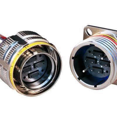 Mating faces of a ruggedized MT38999 circular fiber optic connector plug and square-flange receptacle showing four MT ferrule insert positions