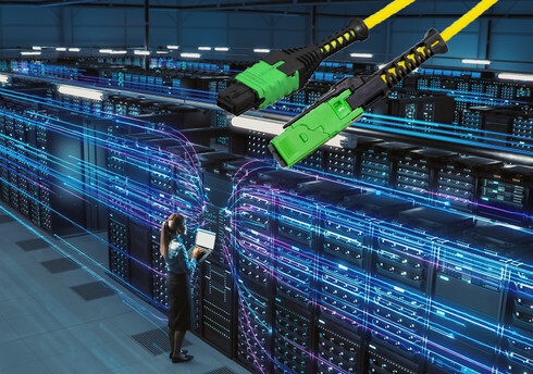 A side-by-side visual comparison of a traditional MTP/MPO fiber connector and a new MMC connector, illustrating the significant increase in port density and space-saving design in a data center rack.