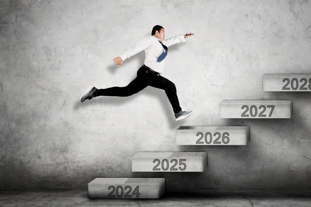 image of a man climbing stairs representing the years 2025 - 2028.