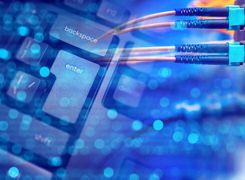 Image of fiber cables connected to a keyboard
